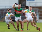 21 November 2021; John McGrath of Loughmore-Castleiney in action against Ross Peters, left, and Conal Kennedy of Clonmel Commercials during the Tipperary County Senior Club Football Championship Final match between Clonmel Commercials and Loughmore-Castleiney at Semple Stadium in Thurles, Tipperary. Photo by Michael P Ryan/Sportsfile