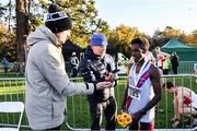 21 November 2021; Senior Men's race winner Hiko Tonosa of Dundrum South Dublin AC, Dublin, is interviewed by journalists Cathal Dennehy, left, and Greg Allen of RTE during the Irish Life Health National Cross Country Championships at Santry Demense in Dublin. Photo by Ramsey Cardy/Sportsfile