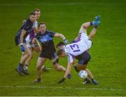 21 November 2021; Paul Mannion of Kilmacud Crokes tumbles over Mark Sweeney of St. Jude's during the Go Ahead Dublin County Senior Club Football Championship Final match between St Jude's and Kilmacud Crokes at Parnell Park in Dublin. Photo by Ray McManus/Sportsfile