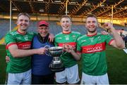 21 November 2021; McGrath brothers, from left, Noel, Brian and John of Loughmore-Castleiney celebrate with their father Pat after the Tipperary County Senior Club Football Championship Final match between Clonmel Commercials and Loughmore-Castleiney at Semple Stadium in Thurles, Tipperary. Photo by Michael P Ryan/Sportsfile