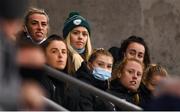 21 November 2021; Republic of Ireland players Denise O'Sullivan and Savannah McCarthy, left, watch on before the 2021 EVOKE.ie FAI Women's Cup Final between Wexford Youths and Shelbourne at Tallaght Stadium in Dublin. Photo by Stephen McCarthy/Sportsfile
