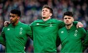 21 November 2021; Ireland players, from left, Robert Baloucoune, Ryan Baird and Harry Byrne during the national anthem before the Autumn Nations Series match between Ireland and Argentina at Aviva Stadium in Dublin. Photo by Seb Daly/Sportsfile