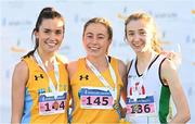 21 November 2021; On the podium after the Women's U23 race, are from left, third placed Danielle Donegan of  UCD AC, Dublin, first placed Sarah Healy of UCD AC, Dublin, and second placed Aoife Ó Cuill of St Coca's AC, Kildare during the Irish Life Health National Cross Country Championships at Santry Demense in Dublin. Photo by Ramsey Cardy/Sportsfile