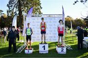 21 November 2021; The podium after the Junior Men's event, from left, third placed Scott Fagan of Metro/St Brigid's AC, Dublin, first placed Nicholas Griggs of Mid Ulster AC, Derry, and second placed Dean Casey of Ennis Track AC, Clare, during the Irish Life Health National Cross Country Championships at Santry Demense in Dublin. Photo by Ramsey Cardy/Sportsfile