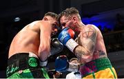 5 November 2021; Sean McComb, left, and Ronnie Clark during their lightweight bout at the Ulster Hall in Belfast. Photo by Ramsey Cardy/Sportsfile