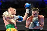 5 November 2021; Sean McComb, right, and Ronnie Clark during their lightweight bout at the Ulster Hall in Belfast. Photo by Ramsey Cardy/Sportsfile