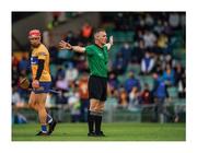 4 July 2021; The penalty that launched a thousand lips. Referee James Owens has no doubts that it’s a penalty, and that the foul merited sending a Clare player to the sin-bin, in applying the new advantage rule, a decision that provokes a barrage of debate, criticism and abuse. Photo by Ray McManus/Sportsfile This image may be reproduced free of charge when used in conjunction with a review of the book &quot;A Season of Sundays 2020&quot;. All other usage © Sportsfile