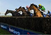 25 November 2021; Ciankyle, right, with Eoin Walsh up, jumps the last on their way to winning the Racing TV Handicap Steeplechase, from second place Dontdooddson, left, with Philip Enright up, and third place Western Sea, centre, with Cathal Landers up, at Thurles Racecourse in Tipperary. Photo by Seb Daly/Sportsfile