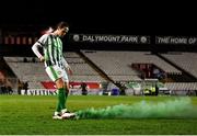19 November 2021; Sam Verdon of Bray Wanderers removes a smoke canister from the pitch during the SSE Airtricity League First Division Play-Off Final match between Bray Wanderers and UCD at Dalymount Park in Dublin. Photo by Piaras Ó Mídheach/Sportsfile