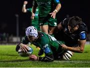 26 November 2021; Mack Hansen of Connacht scores his side's first try, as he's tackled by Ethan Roots of Ospreys, during the United Rugby Championship match between Connacht and Ospreys at The Sportsground in Galway. Photo by Piaras Ó Mídheach/Sportsfile