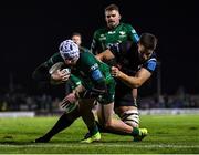 26 November 2021; Mack Hansen of Connacht on his way to scoring his side's first try, as he's tackled by Ethan Roots of Ospreys, during the United Rugby Championship match between Connacht and Ospreys at The Sportsground in Galway. Photo by Piaras Ó Mídheach/Sportsfile