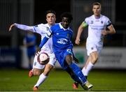 26 November 2021; Junior Quitirna of Waterford in action against Sean Brennan of UCD during the SSE Airtricity League Promotion / Relegation Play-off Final between UCD and Waterford at Richmond Park in Dublin. Photo by Stephen McCarthy/Sportsfile