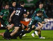 26 November 2021; Caolin Blade of Connacht breaks through the attempted tackle from Joe Hawkins of Ospreys on his way to scoring his side's sixth try during the United Rugby Championship match between Connacht and Ospreys at The Sportsground in Galway. Photo by David Fitzgerald/Sportsfile