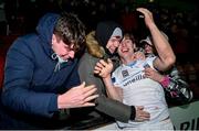 26 November 2021; UCD goalscorer Dara Keane celebrates with supporters after his side's victory in the SSE Airtricity League Promotion / Relegation Play-off Final between UCD and Waterford at Richmond Park in Dublin. Photo by Stephen McCarthy/Sportsfile