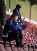 26 November 2021; A Waterford supporter sits in the stand after their defeat in the SSE Airtricity League Promotion / Relegation Play-off Final between UCD and Waterford at Richmond Park in Dublin. Photo by Stephen McCarthy/Sportsfile