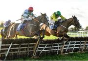 27 November 2021; Gringo D'aubrelle, left, with Davy Russell up, jumps the last on their way to winning the St Peter's Dunboyne GAA Maiden Hurdle Div 1, from second place Adamantly Chosen, right, with Danny Mullins up, on day one of the Fairyhouse Winter Festival at Fairyhouse Racecourse in Ratoath, Meath. Photo by Seb Daly/Sportsfile