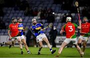 27 November 2021; Stephen Bergin of Clough-Ballacolla scores a point despite the efforts of Liam Ryan, 3, and James Peare of Rapparees during the AIB Leinster GAA Hurling Senior Club Championship Quarter-Final match between Clough-Ballacolla and Rapparees at MW Hire O'Moore Park in Portlaoise, Laois. Photo by Sam Barnes/Sportsfile