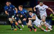 27 November 2021; Ciarán Frawley of Leinster offloads to  Ross Molony of Leinster as he is tackled by Nick Timoney of Ulster during the United Rugby Championship match between Leinster and Ulster at the RDS Arena in Dublin. Photo by Harry Murphy/Sportsfile