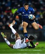 27 November 2021; Adam Byrne of Leinster skips past the attempted tackle of Billy Burns of Ulster during the United Rugby Championship match between Leinster and Ulster at RDS Arena in Dublin.  Photo by Piaras Ó Mídheach/Sportsfile