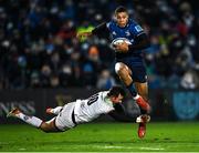 27 November 2021; Adam Byrne of Leinster skips past the attempted tackle of Billy Burns of Ulster during the United Rugby Championship match between Leinster and Ulster at RDS Arena in Dublin.  Photo by Piaras Ó Mídheach/Sportsfile