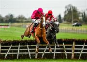28 November 2021; Lunar Power, with Bryan Cooper up, left, jumps the last alongside eventual winner Fil Dor, with Davy Russel up, on their way to finishing second in the Bar One Racing Juvenile Hurdle on day two of the Fairyhouse Winter Festival at Fairyhouse Racecourse in Ratoath, Meath. Photo by David Fitzgerald/Sportsfile