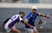 28 November 2021; Robbie Greville of Raharney Hurling Club in action against Mark Howard of Kilmacud Crokes during the 2021 AIB Leinster Club Senior Hurling Championship Quarter-Final match between Raharney Hurling Club and Kilmacud Crokes at TEG Cusack Park in Mullingar, Westmeath. Photo by Dáire Brennan/Sportsfile