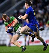 28 November 2021; Ross Mannix of Clonakilty is fouled by Billy Hennessy of St Finbarr's during the Cork County Senior Club Football Championship Final match between Clonakilty and St Finbarr's at Páirc Uí Chaoimh in Cork. Photo by Piaras Ó Mídheach/Sportsfile