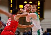 28 November 2021; John Carroll of Ireland in action against Marvin Ogunsipe of Austria during the FIBA EuroBasket 2025 Pre-Qualifiers First Round Group A match between Ireland and Austria at National Basketball Arena in Tallaght, Dublin. Photo by Brendan Moran/Sportsfile