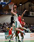 28 November 2021; John Carroll of Ireland in action against Guylain Mbemba of Austria during the FIBA EuroBasket 2025 Pre-Qualifiers First Round Group A match between Ireland and Austria at National Basketball Arena in Tallaght, Dublin. Photo by Brendan Moran/Sportsfile