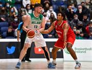 28 November 2021; Jordan Blount of Ireland in action against Guylain Mbemba of Austria during the FIBA EuroBasket 2025 Pre-Qualifiers First Round Group A match between Ireland and Austria at National Basketball Arena in Tallaght, Dublin. Photo by Brendan Moran/Sportsfile