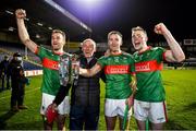 28 November 2021; The McGrath family, from left, John, Pat, Noel and Brian celebrate with the trophy after their side's victory in the Tipperary County Senior Club Hurling Championship Final Replay match between Thurles Sarsfields and Loughmore/Castleiney at Semple Stadium in Thurles, Tipperary. Photo by Harry Murphy/Sportsfile