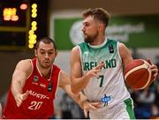28 November 2021; Sean Flood of Ireland in action against Jakob Szkutta of Austria during the FIBA EuroBasket 2025 Pre-Qualifiers First Round Group A match between Ireland and Austria at National Basketball Arena in Tallaght, Dublin. Photo by Brendan Moran/Sportsfile