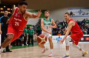 28 November 2021; Sean Flood of Ireland in action against Marvin Ogunsipe, left, and Thomas Klepiesz of Austria during the FIBA EuroBasket 2025 Pre-Qualifiers First Round Group A match between Ireland and Austria at National Basketball Arena in Tallaght, Dublin. Photo by Brendan Moran/Sportsfile