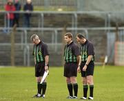 28 March 2004; Referee Seamus McCormack stands with his linesmen Paul Finnegan, left, and Robert O'Donnell, centre, for a minutes silence in honour of Irish U-19 rugby player John McCall. Allianz Football League, Division 1a, Tyrone v Cork, Healy Park, Omagh, Co Tyrone. Picture credit; Ray McManus / SPORTSFILE *EDI*