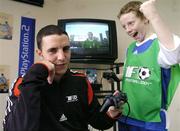 29 March 2004; 11 year old Craig O'Reilly beats Manchester United and Republic of Ireland defender John O'Shea at the Official launch of the &quot;This Is Football 2004&quot; game on Playstation 2. Alsaa Sports Centre, Dublin. Picture credit; David Maher / SPORTSFILE *EDI*