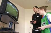 29 March 2004; 11 year old Craig O'Reilly from Dublin plays Manchester United and Republic of Ireland defender John O'Shea during a game at the Official launch of the &quot;This Is Football 2004&quot; on Playstation 2. Alsaa Sports Centre, Dublin. Picture credit; David Maher / SPORTSFILE *EDI*