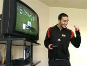 29 March 2004; Manchester United and Republic of Ireland defender John O'Shea celebrates after scoring a goal while playing at the Official launch of the &quot;This Is Football 2004&quot; game on Playstation 2. Alsaa Sports Centre, Dublin.  Picture credit; David Maher / SPORTSFILE *EDI*