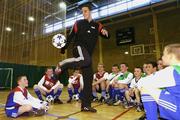 29 March 2004; Manchester United and Republic of Ireland defender John O'Shea shows off  his skills to prize winners at the Official launch of the &quot;This Is Football 2004&quot; game on Playstation 2. Alsaa Sports Centre, Dublin. Picture credit; David Maher / SPORTSFILE *EDI*