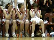 30 March 2004; Players from St. Mary's Edenderry, from left, Janet Kelly, Natasha Cullen and Riona Harrison watch the final moments of the game. All - Ireland Schoolgirls Basketball League, Cadette 'C' Final, St. Mary's Edenderry, Co. Offaly, v Dunmore Community School, Co. Galway, ESB Arena, Tallaght, Dublin. Picture credit; Brendan Moran / SPORTSFILE *EDI*