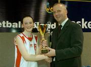 30 March 2004; Siobhan Hurley, captain of St. Mary's Edenderry, receives the cup from Martin Hehir, Schools Development Officer of Basketball Ireland. All - Ireland Schoolgirls Basketball League, Cadette 'C' Final, St. Mary's Edenderry, Co. Offaly, v Dunmore Community School, Co. Galway, ESB Arena, Tallaght, Dublin. Picture credit; Brendan Moran / SPORTSFILE *EDI*