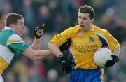 21 March 2004; John Rogers, Roscommon, in action against Ciaran McManus, Offaly. Allianz Football League 2004, Division 2A, Round 6, Offaly v Roscommon, O'Connor Park, Tullamore, Co. Offaly. Picture credit; David Maher / SPORTSFILE *EDI*