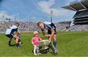 14 July 2013; Eoghan O'Gara with his 21 month old daughter Ella O'Gara after the match. Leinster GAA Football Senior Championship Final, Meath v Dublin, Croke Park, Dublin. Picture credit: Brian Lawless / SPORTSFILE