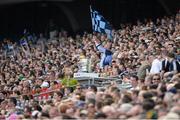 14 July 2013; A Dublin fan waves a flag. Leinster GAA Football Senior Championship Final, Meath v Dublin, Croke Park, Dublin. Picture credit: Brian Lawless / SPORTSFILE