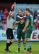 26 July 2013; Referee Padraig Sutton shows the red card to Cork City's Kalen Spillane, right, as his team-mate Dan Murray tries to intervene. Airtricity League Premier Division, St. Patrick’s Athletic v Cork City, Richmond Park, Dublin. Picture credit: David Maher / SPORTSFILE