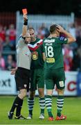 26 July 2013; Referee Padraig Sutton shows the red card to Cork City's Kalen Spillane, right, as his team-mate Dan Murray tries to intervene. Airtricity League Premier Division, St. Patrick’s Athletic v Cork City, Richmond Park, Dublin. Picture credit: David Maher / SPORTSFILE