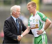 21 July 2013; London captain Seamus Hannon is greeted by President of the Connacht Council Proinsias de Búrca. Connacht GAA Football Senior Championship Final, Mayo v London, Elverys MacHale Park, Castlebar, Co. Mayo. Picture credit: Stephen McCarthy / SPORTSFILE