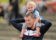 27 July 2013; Former Irish international athlete David Matthews with his one year old son James at the Woodie’s DIY National Senior Track and Field Championships. Morton Stadium, Santry, Co. Dublin. Picture credit: Matt Browne / SPORTSFILE