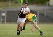 27 July 2013; Maud Annie Foley, Westmeath, in action against Laura Brennan, Donegal. TG4 All-Ireland Ladies Senior Football Championship, Round 1, Qualifier, Donegal v Westmeath, Pairc Sean Mac Diarmada, Carrick-on-Shannon, Co. Leitrim. Picture credit: Oliver McVeigh / SPORTSFILE