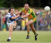 27 July 2013; Padraig McMahon, Laois, in action against Neil Gallagher, Donegal. GAA Football All-Ireland Senior Championship, Round 4, Donegal v Laois, Pairc Sean Mac Diarmada, Carrick-on-Shannon, Co. Leitrim. Picture credit: Oliver McVeigh / SPORTSFILE