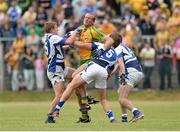 27 July 2013; Neil Gallagher, Donegal, in action against David Conway and Darren Strong, Laois. GAA Football All-Ireland Senior Championship, Round 4, Donegal v Laois, Pairc Sean Mac Diarmada, Carrick-on-Shannon, Co. Leitrim. Picture credit: Oliver McVeigh / SPORTSFILE